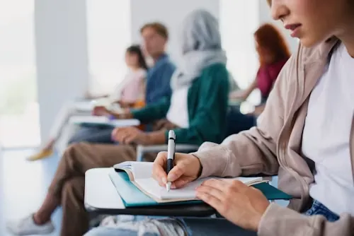 A university student in Dubai receiving academic support with coursework report writing