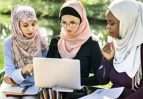A university student in Dubai reviewing academic sources for a literature review