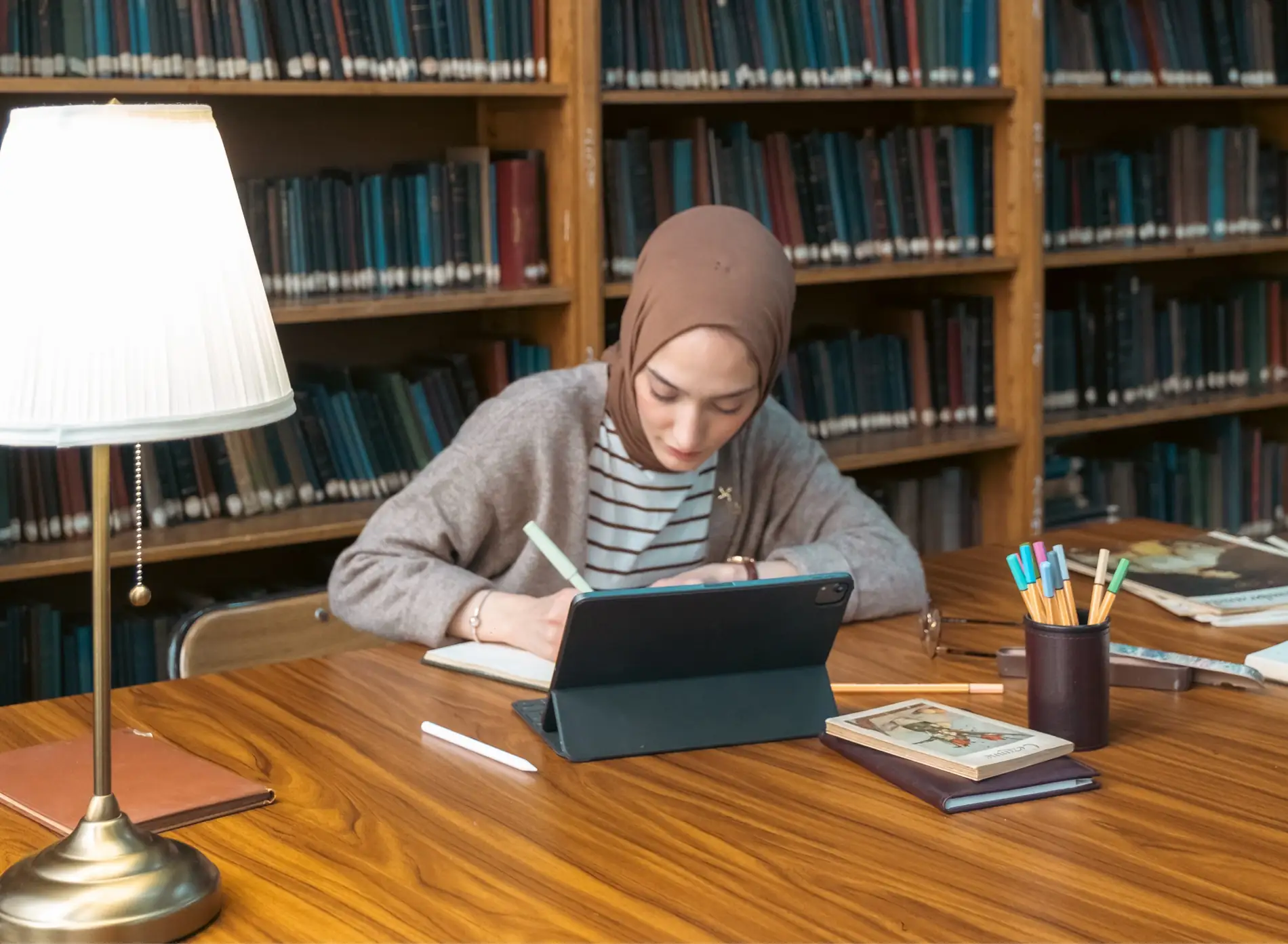 Professional academic writer preparing a personal statement for a student using personal statement and SOP writing help in Abu Dhabi.